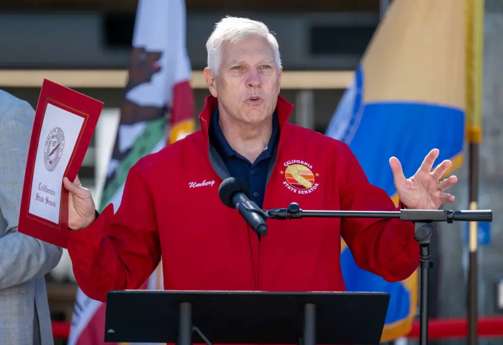 State Senator Tom Umberg speaks during a ribbon cutting ceremony...