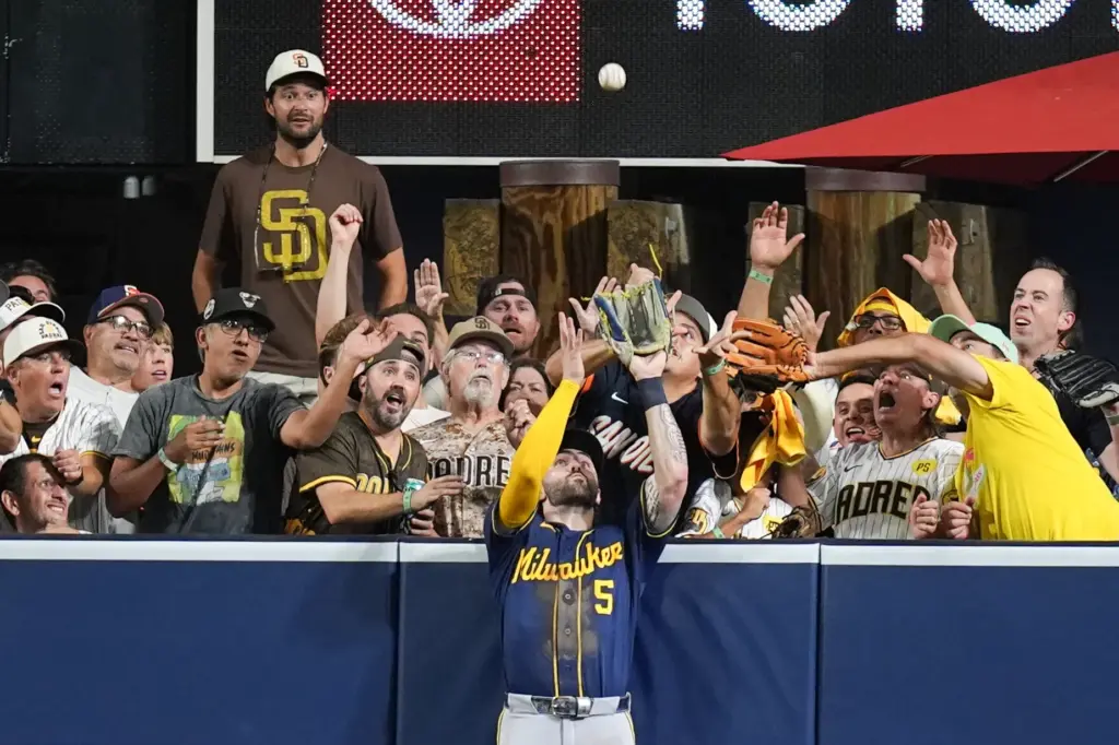 Milwaukee Brewers center fielder Garrett Mitchell catches a ball hit...