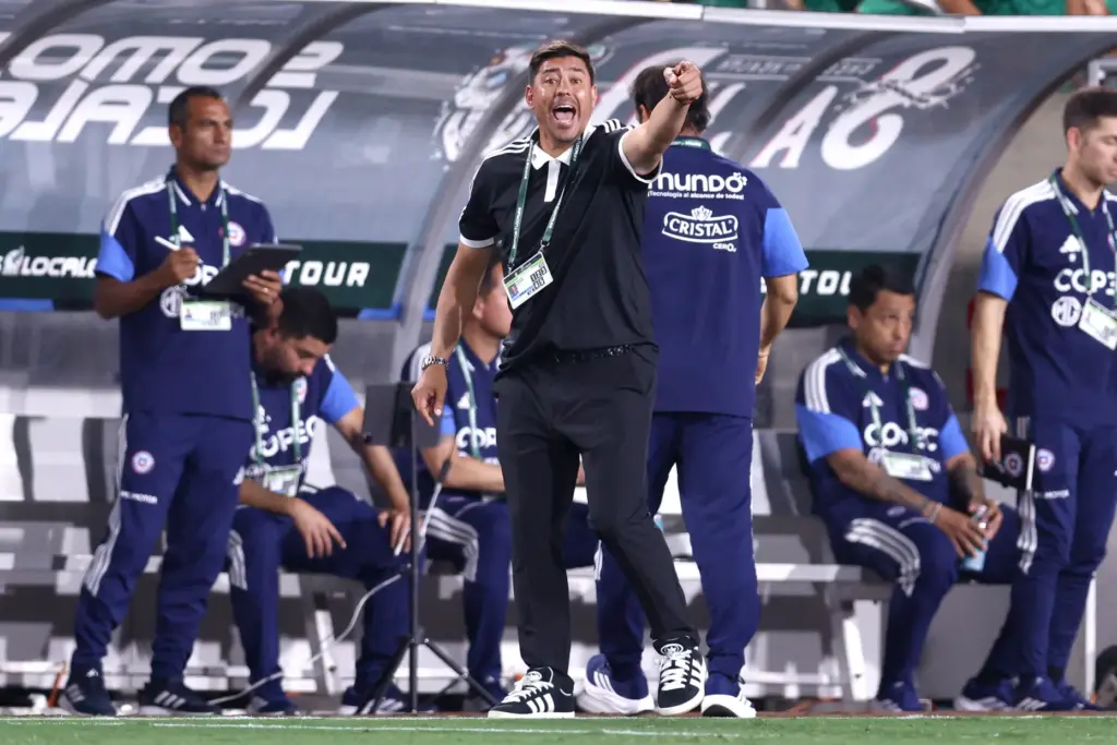 Chile head coach Nicolas Cordova, center, reacts on the sideline...