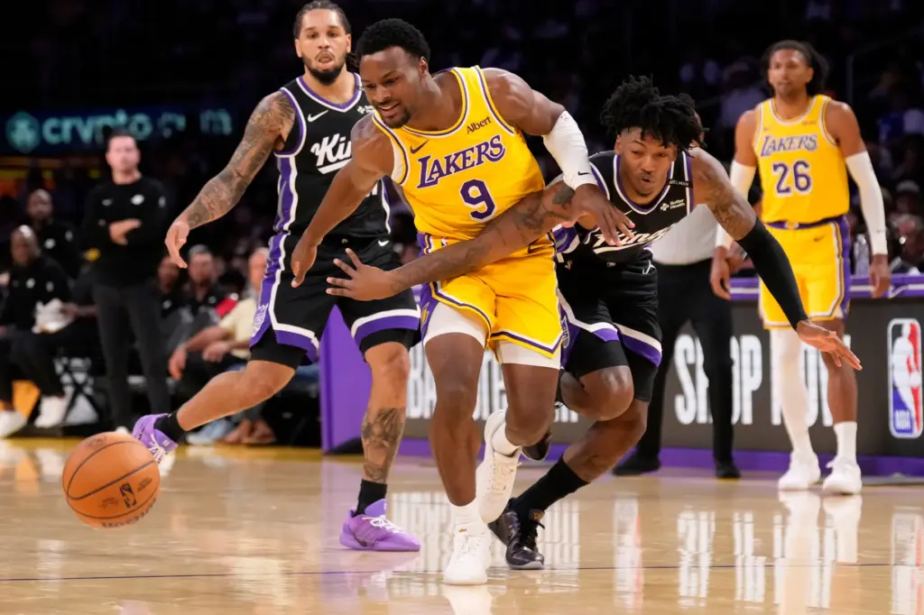 Sacramento Kings guard Elfrid Payton, second from right, knocks the...