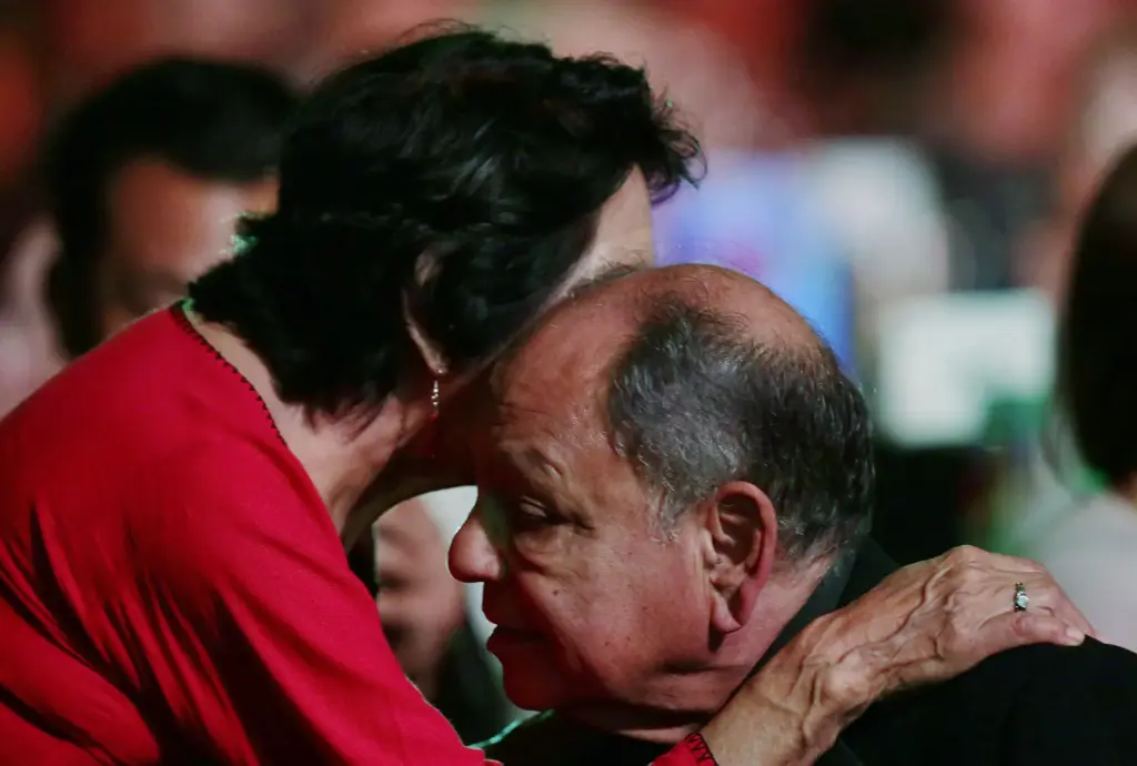 Cheech Marin listens to Dolores Huerta after she receives an...