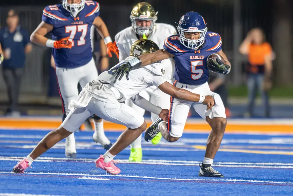 Chaminade High Schoolâs Cameron Blackman (5) is tackled by Notre...