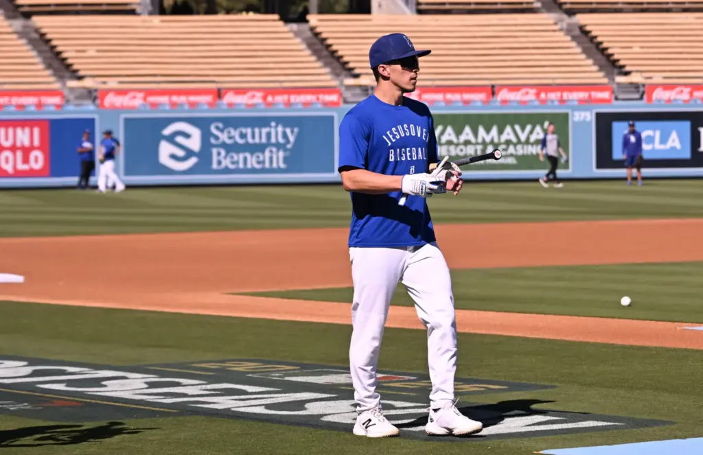 Dodgers utility player Tommy Edman waits his turn during batting...