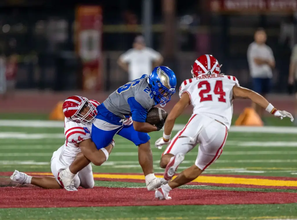 Santa Margarita running back Adrian Petero (26) breaks a tackle...