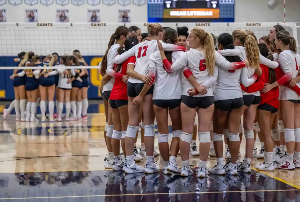 Crean Lutheran players, left, and Redondo Union players huddle together...