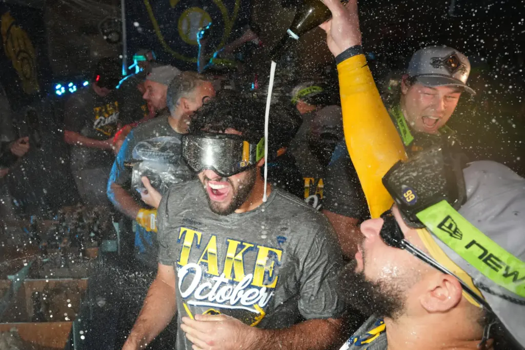 Milwaukee Brewers players celebrate after the team defeated the San...