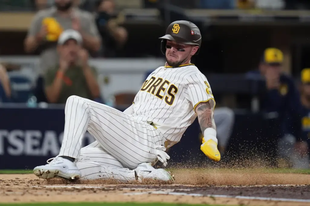 The San Diego Padres’ Jackson Merrill scores during the third...