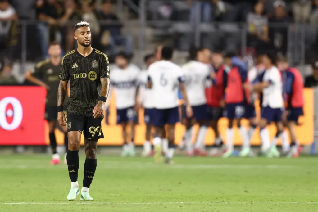 A frustrated Los Angeles FC forward Denis Bouanga, front, closes...