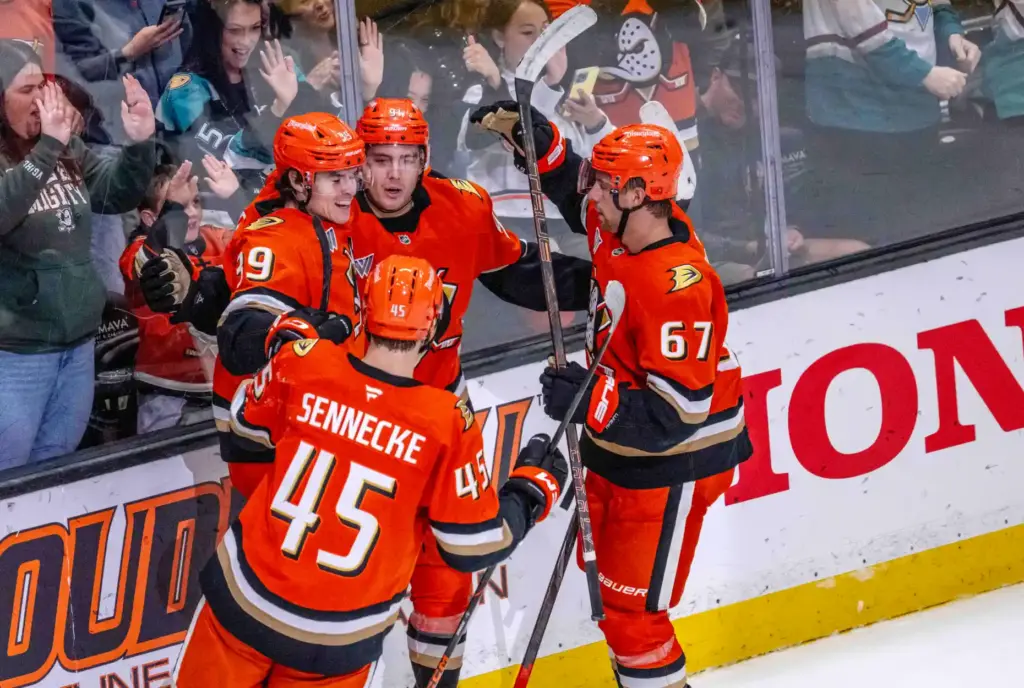 Ducks players Jeff Malott (39), Beckett Sennecke (45) and Tristan...