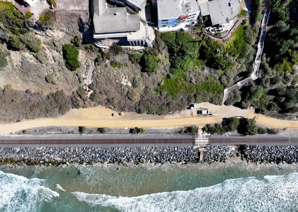 Workers put the finishing touches on the beach trail north...
