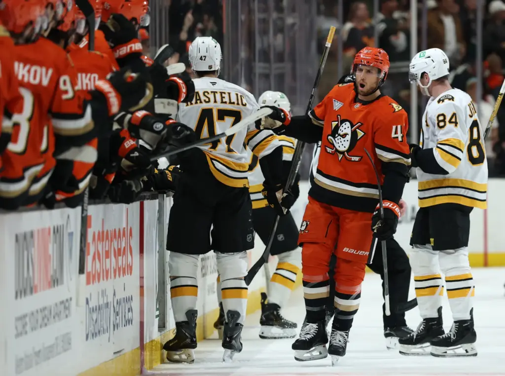 The Ducks’ Tim Washe (42) celebrates his goal as he...