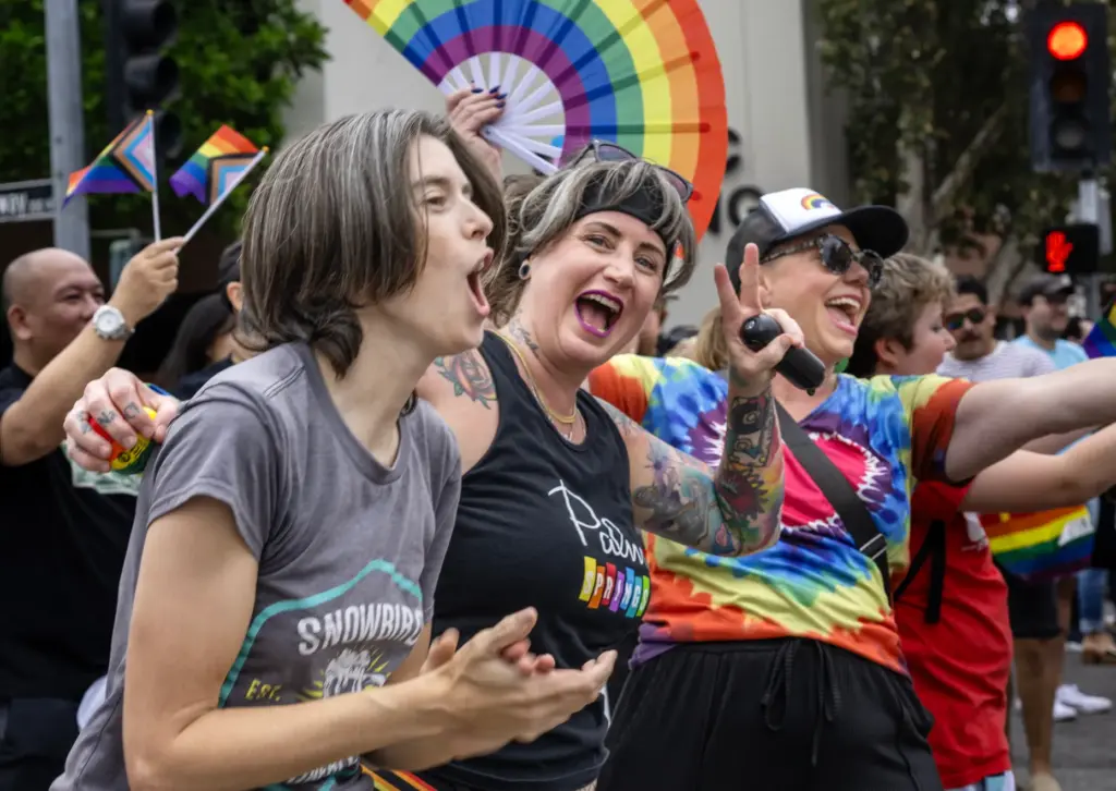 OC Pride parade spectators Becca Wilhelm, left, and Ryann Crofoot...