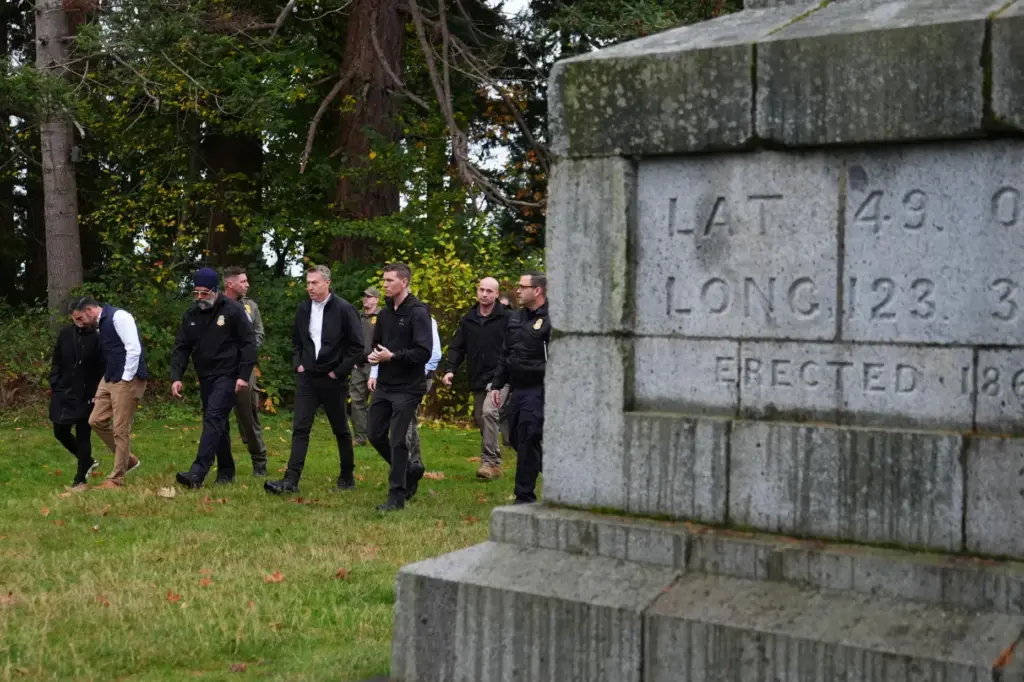 Commissioner of U.S. Customs and Border Protection Rodney Scott walks with officers at Monument Park.