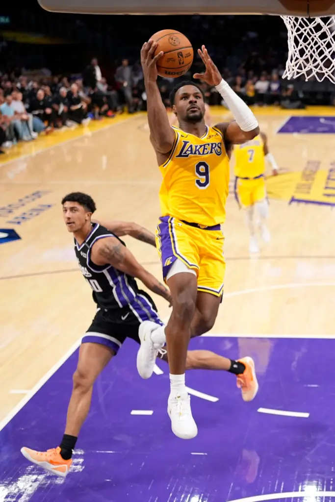 Lakers guard Bronny James gets to the basket for a...