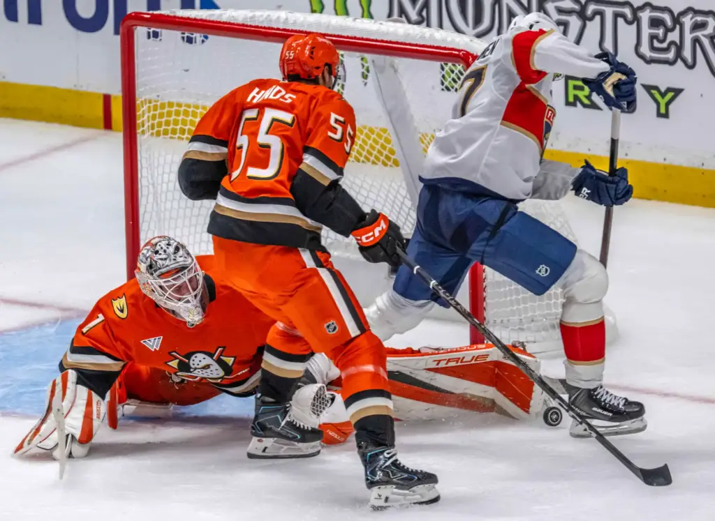 Ducks goaltender Lukas Dostal stretches to block a shot attempt...