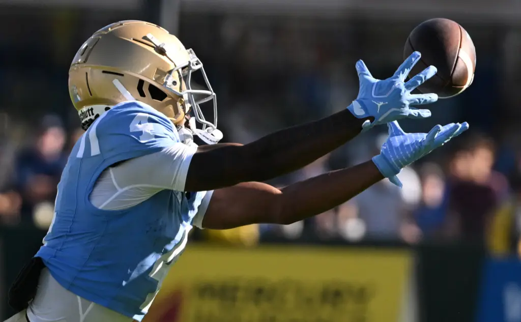 UCLA wide receiver Semaj Morgan (4) reaches for a pass...