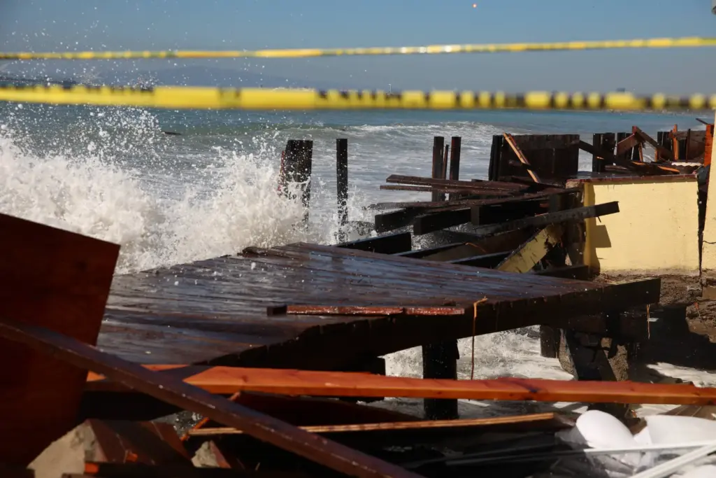 Waves continue to crash into the already heavily damaged boardwalk...