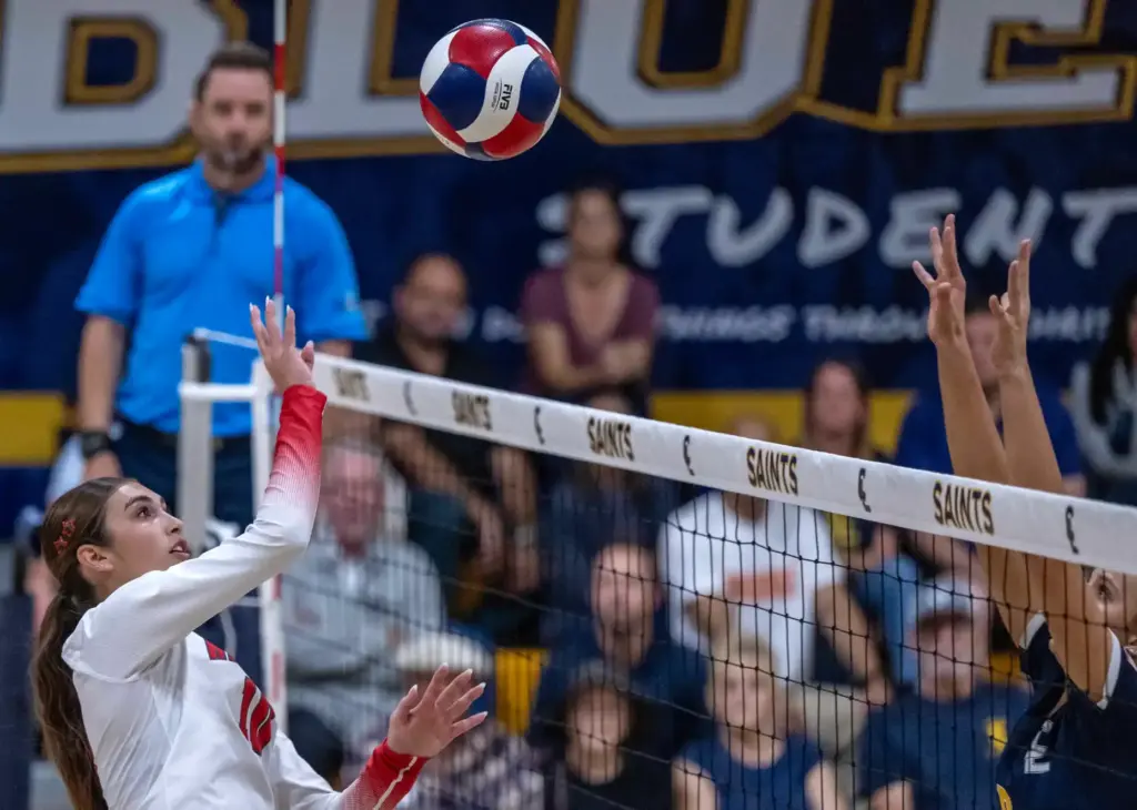 Redondo Union middle blocker Sienna Castillo (10) tips the ball...