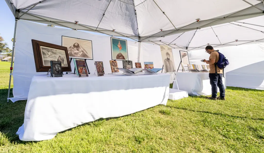 Mario Rodriguez views artwork by Charles White during a groundbreaking...