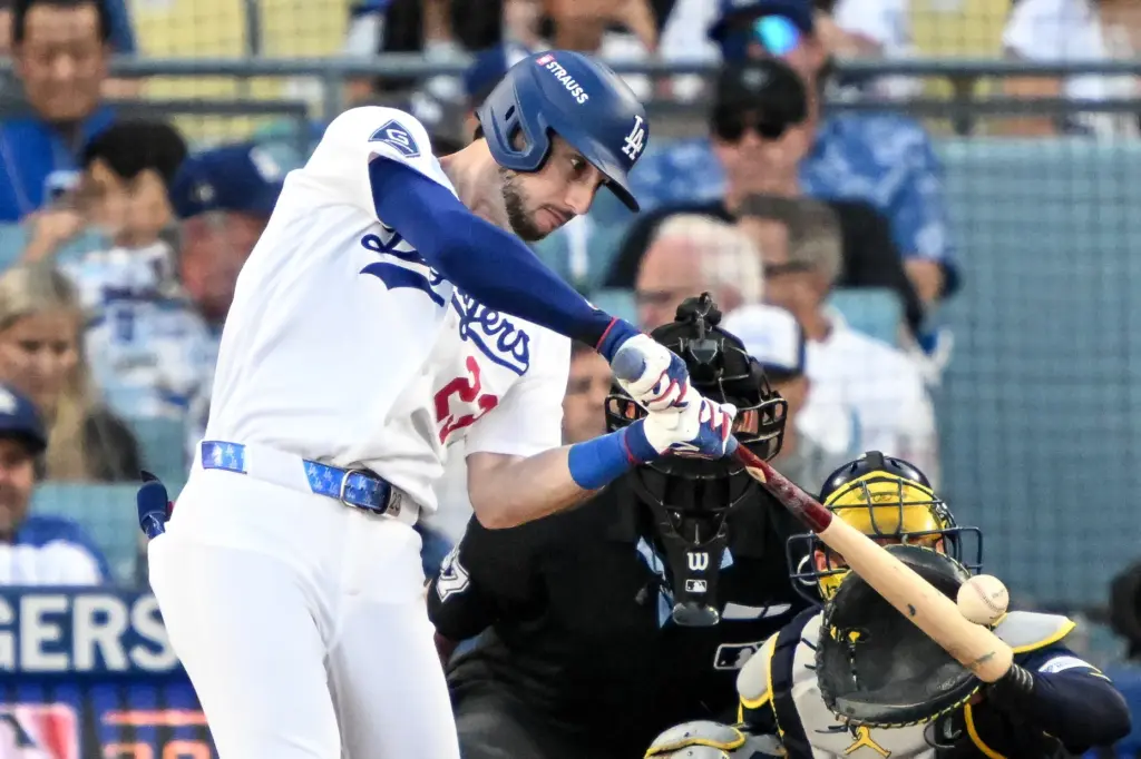 The Dodgers’ Kyle Tucker connects for a single during the...