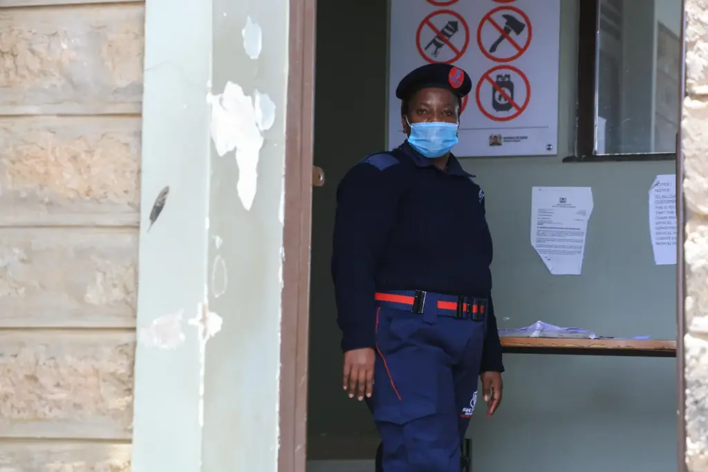 A security guard wears a mask at the Ministry of...