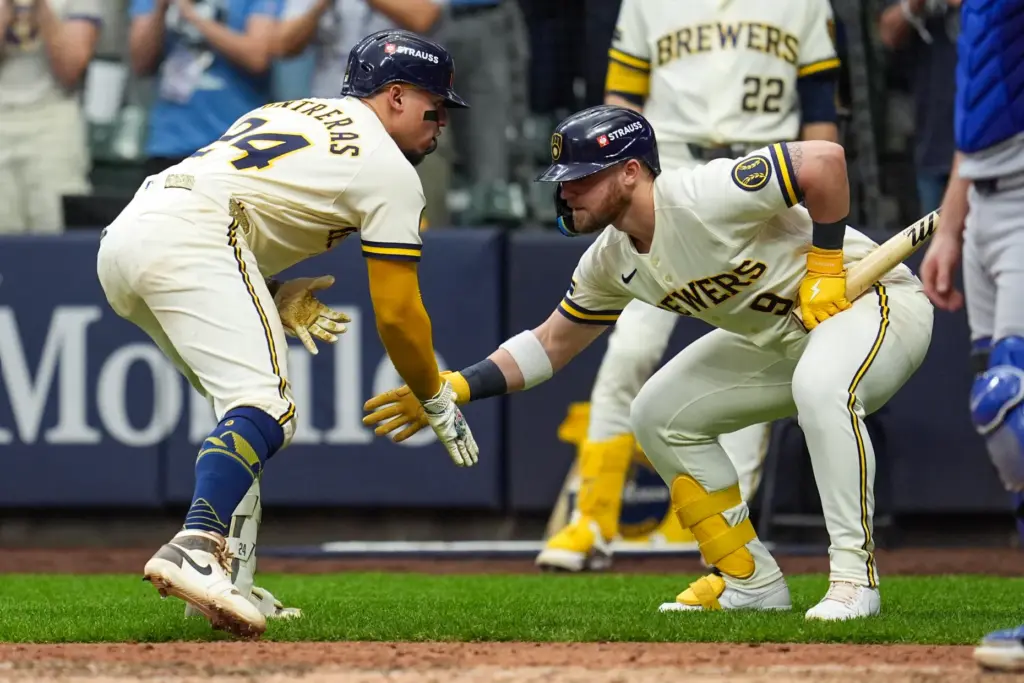 The Milwaukee Brewers’ William Contreras, left, celebrates with teammate Jake...