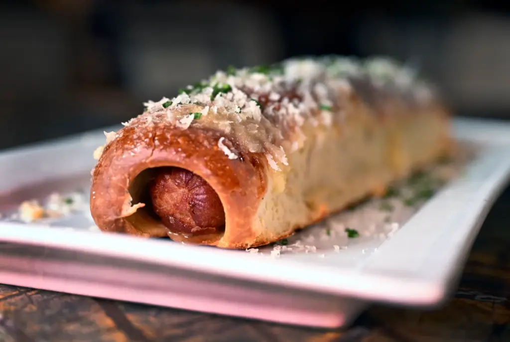 The Golden Dog is an all-beef hot dog fried in...
