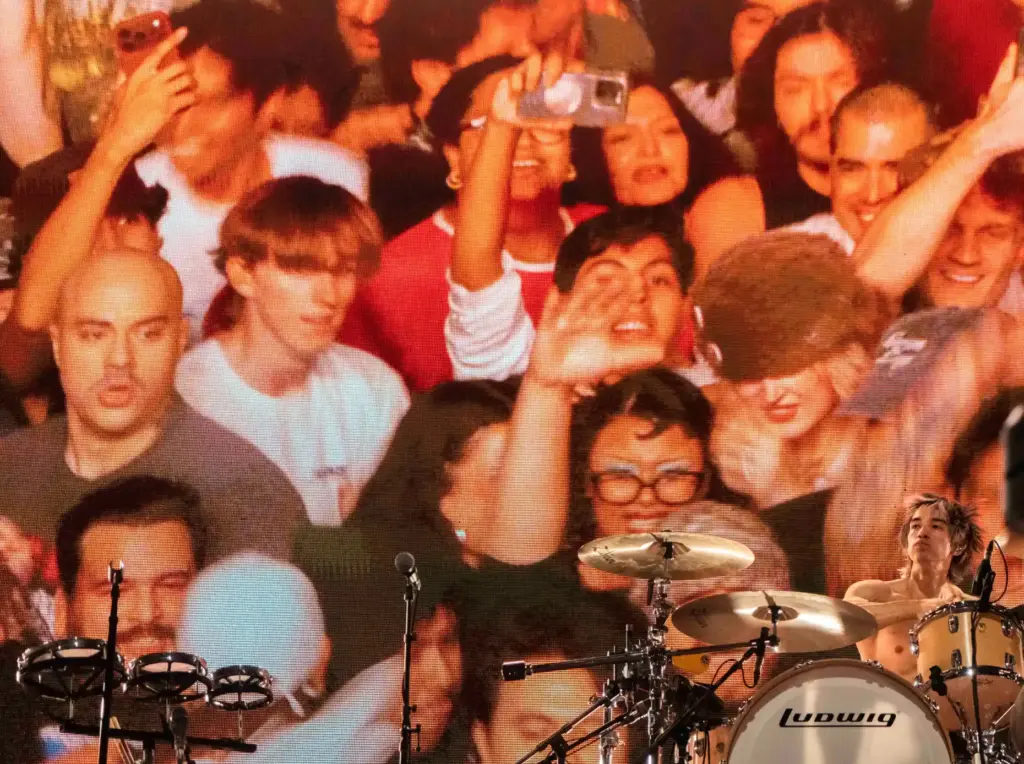 Turnstile drummer Daniel Fang performs as the bandâs visuals of...