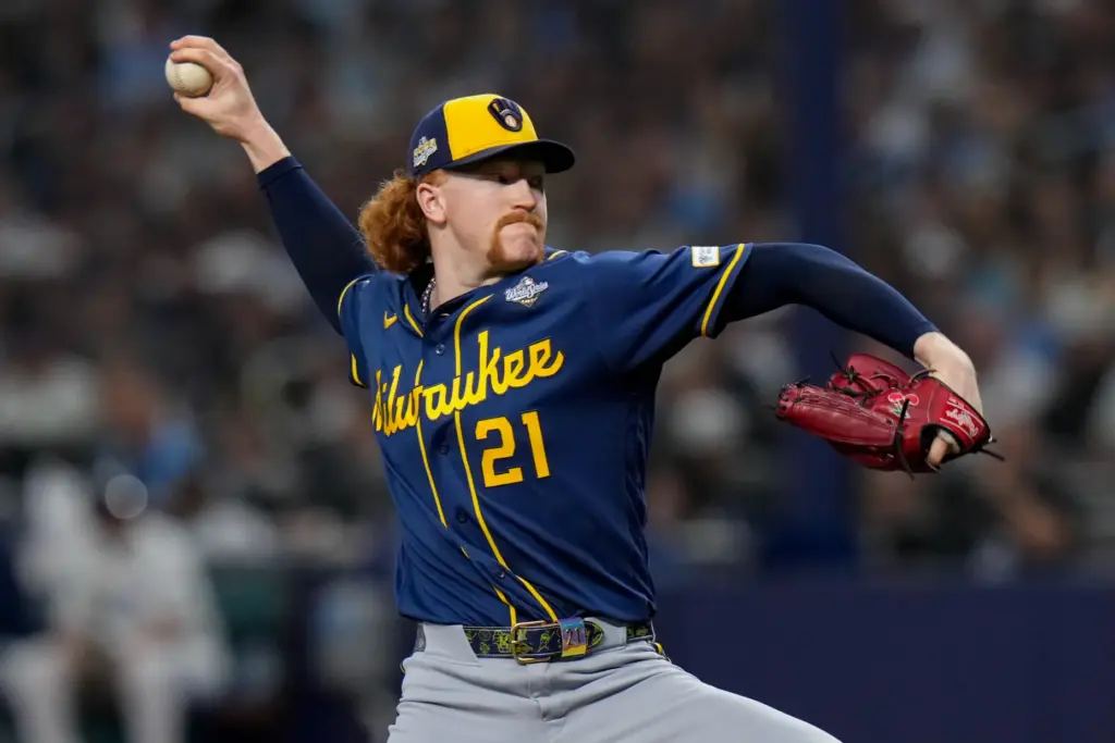 Milwaukee Brewers starting pitcher Dustin May throws to the plate...