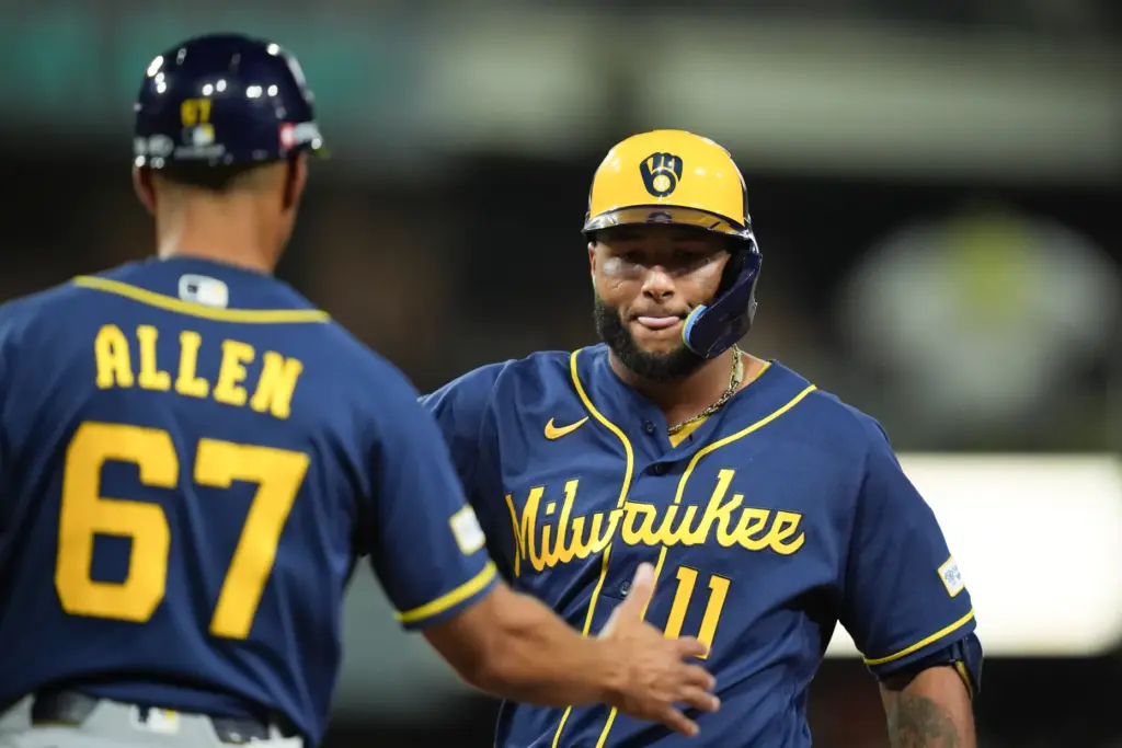 The Milwaukee Brewers’ Jackson Chourio (11) is congratulated by first...