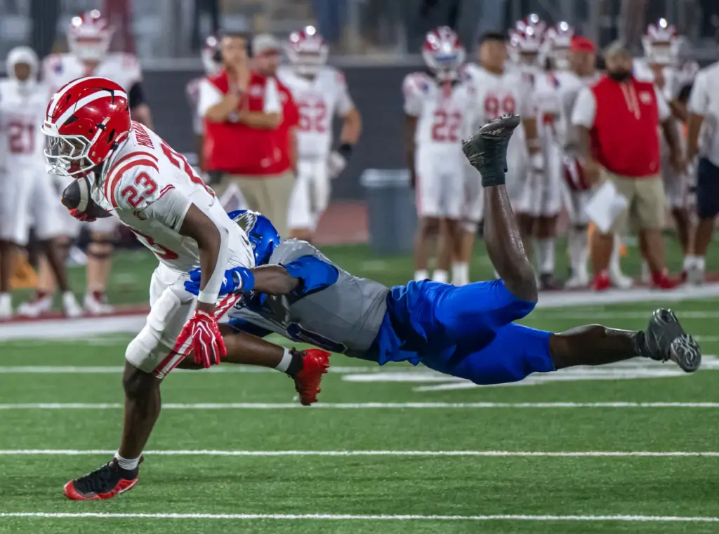 Mater Dei running back Mark Allen Jr. (23) breaks a...