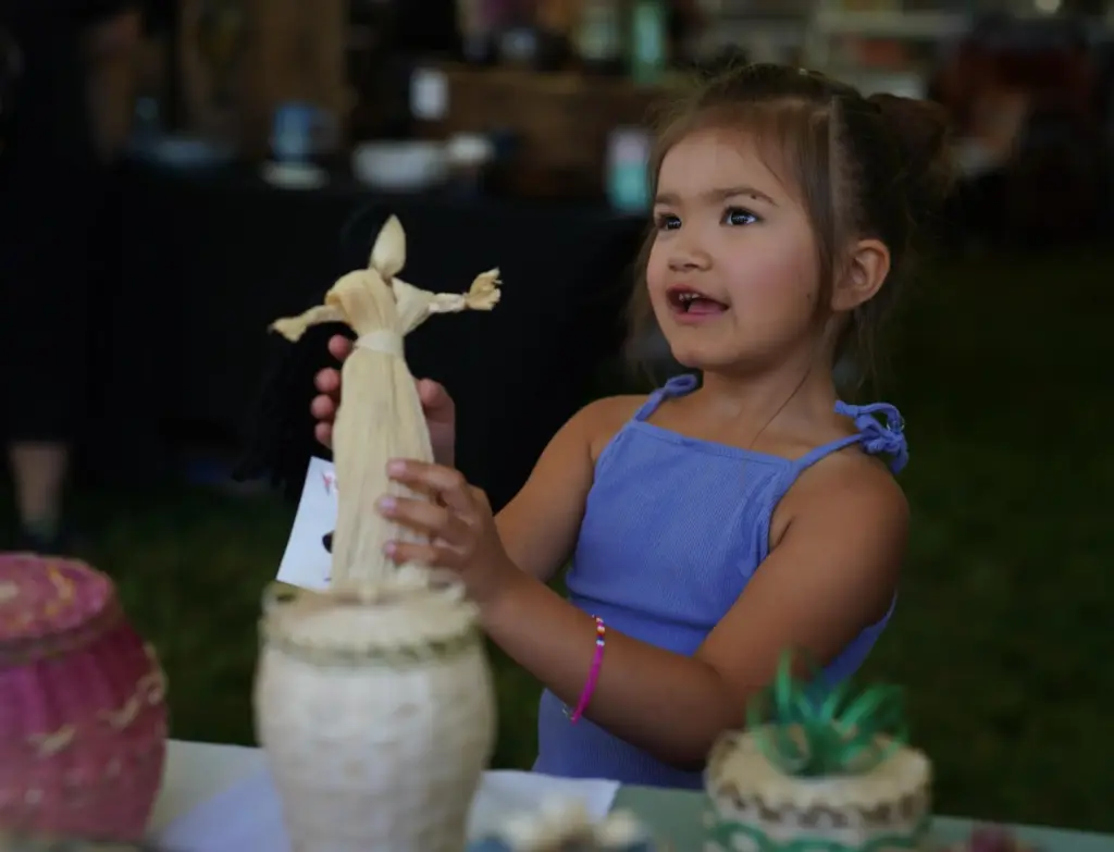 Lydia Soctomah’s daughter holds a present gifted to her at...