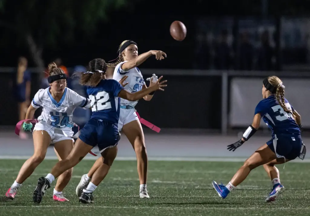 Corona del Mar quarterback Charlotte Ring (26) throws the ball...