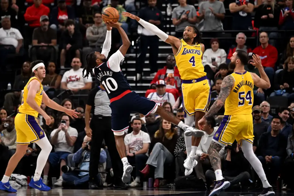 Clippers point guard Darius Garland (10) takes a shot as...