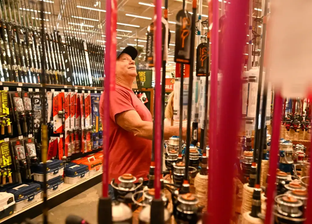 Oran Pentz checks out fishing gear at Bass Pro Shops...