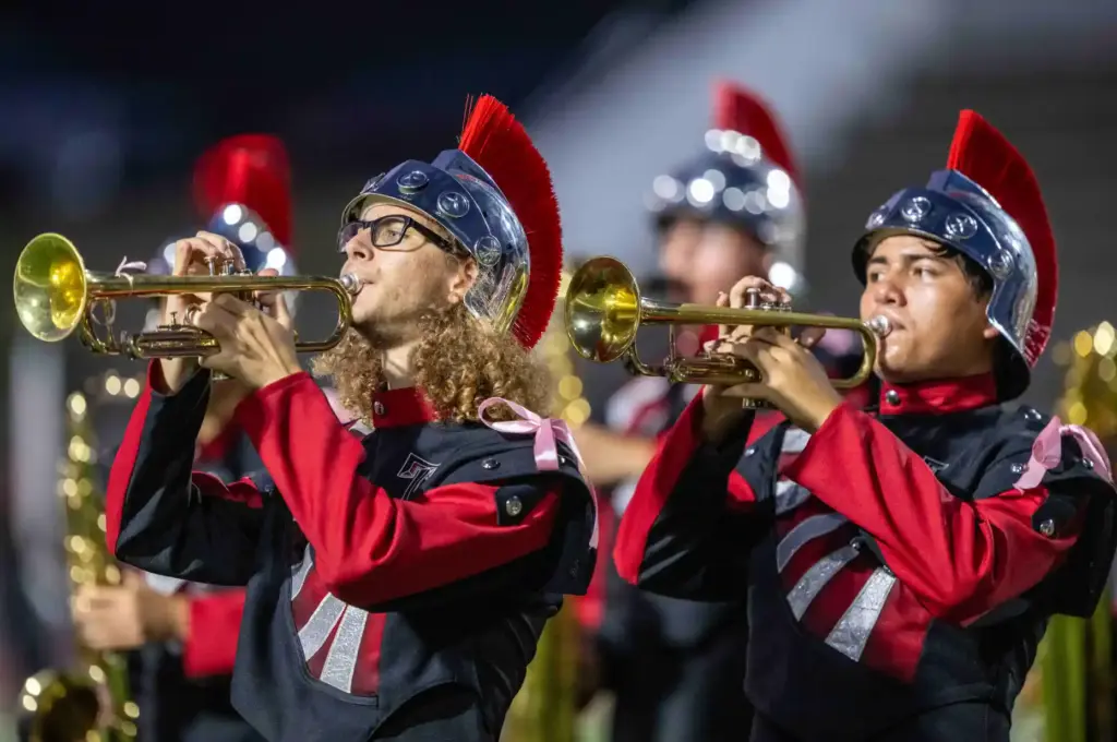 Members of the Troy High School Marching Band perform the...