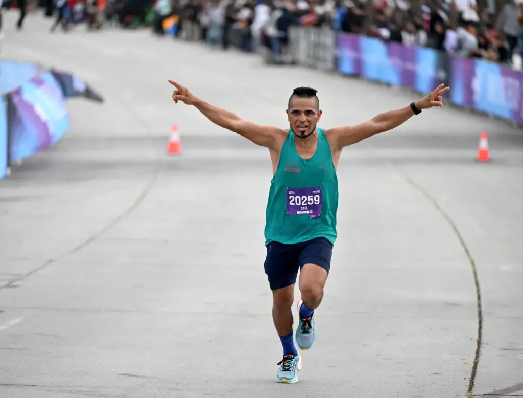 Saul Palacios crosses the finish line, dedicating his run to...