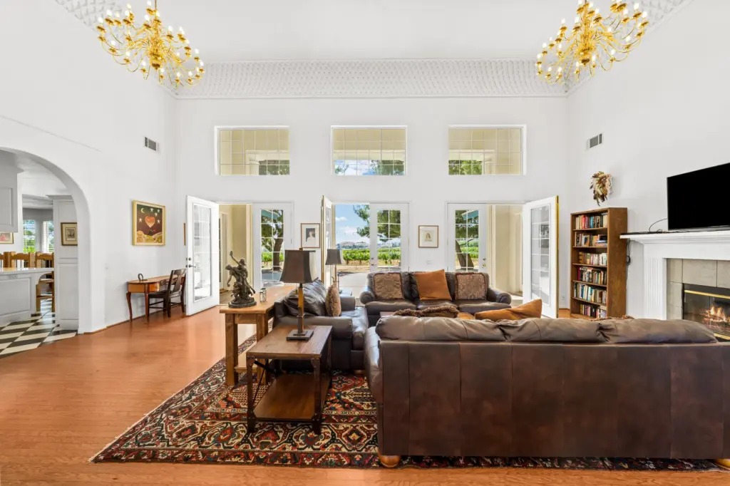 Soaring ceilings, French doors, clerestory windows and wood flooring define...