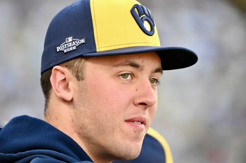 Milwaukee Brewers pitcher Jacob Misiorowski looks on from the dugout...