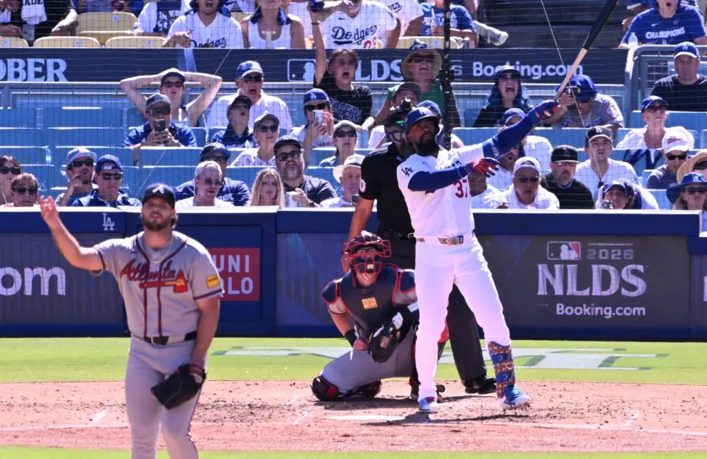 The Dodgers’ Teoscar HernÃ¡ndez watches the flight of his two-run...