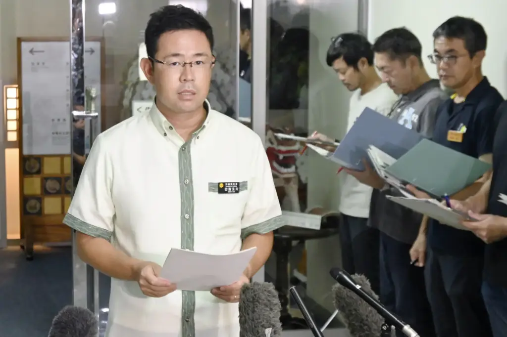 Okinawa Gov. Genta Koja speaks to the media at his prefectural building in Naha.