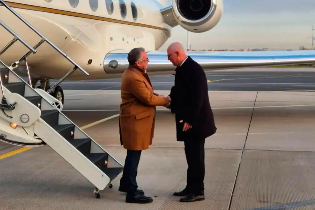 Russian presidential envoy Kirill Dmitriev greets U.S. special envoy Steve Witkoff.