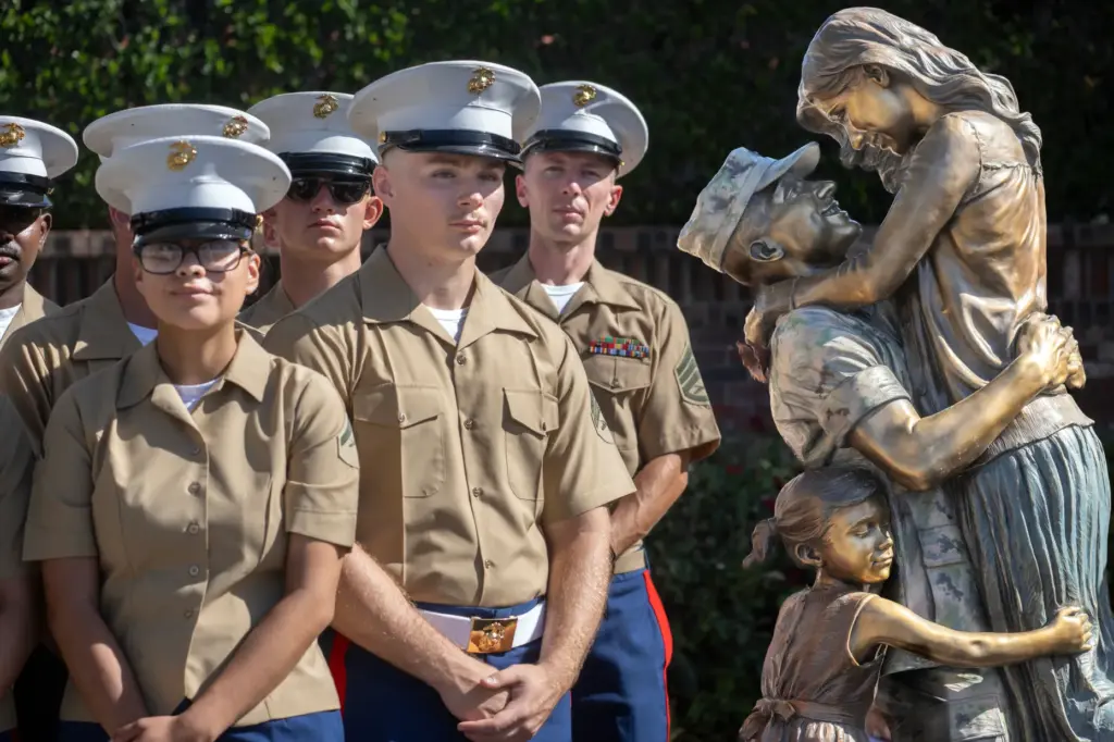 Camp Pendleton Marines with the 5th Regiment gather around the...