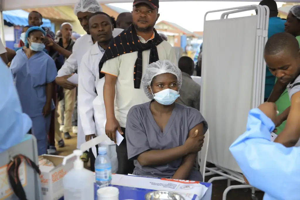 Health care workers queue to receive a dose of Ervebo vaccine against the Ebola virus.
