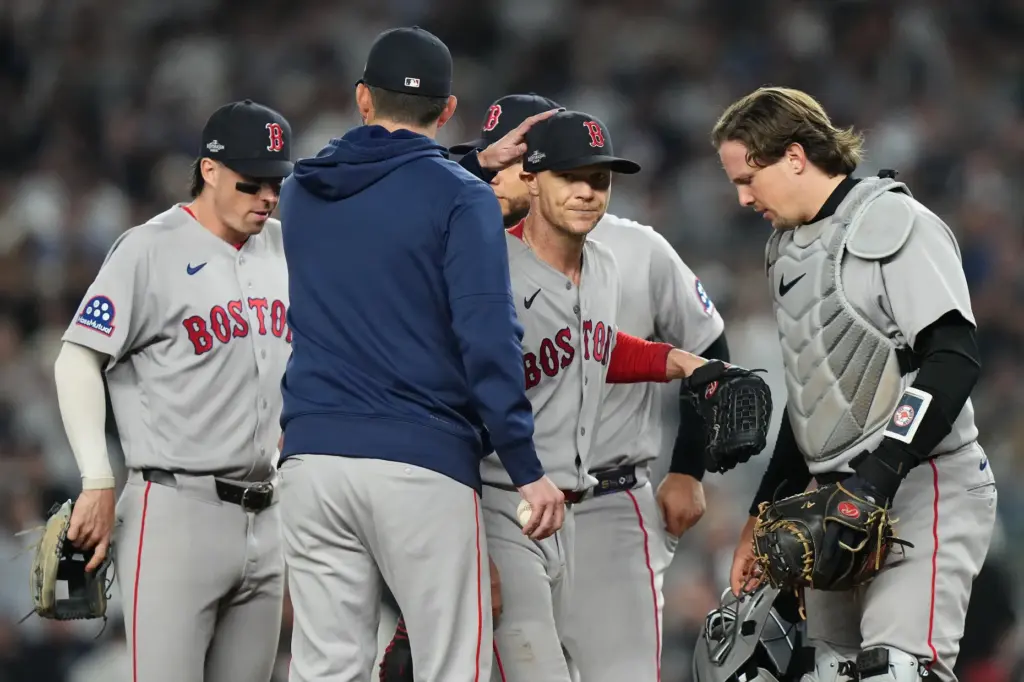 Boston Red Sox starting pitcher Sonny Gray, center facing, is...