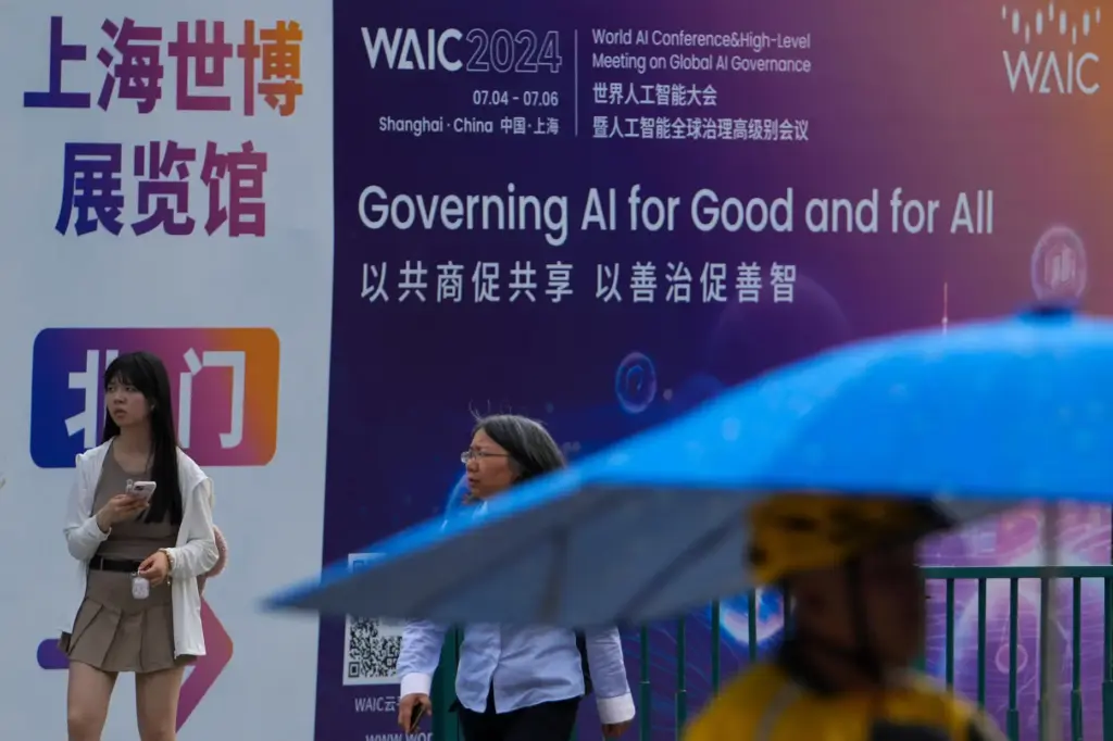 FILE – People walk by an advertisement billboard promoting the...