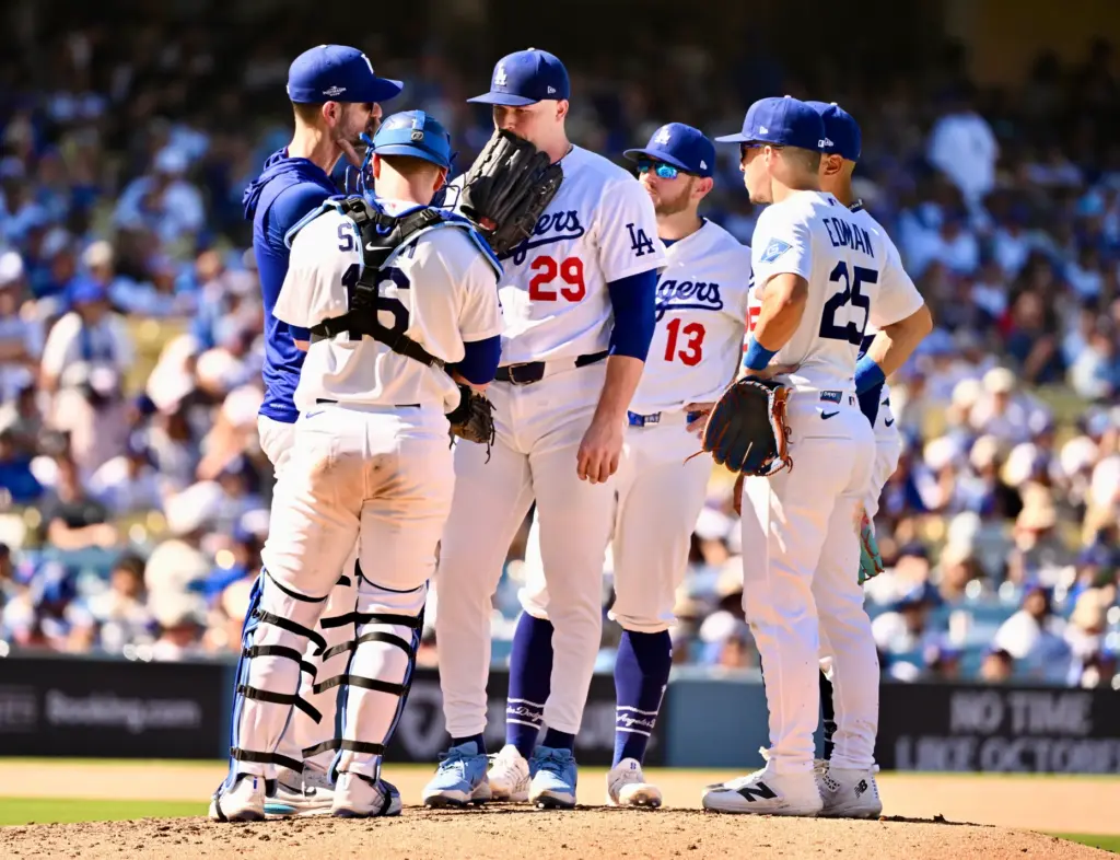 Dodgers pitching coach Mark Prior, far left, talks with starting...