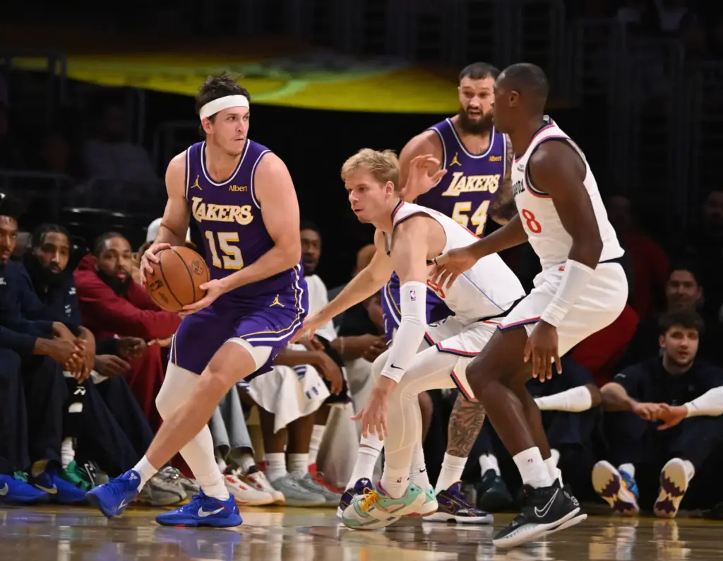Lakers guard Austin Reaves handles the ball as Clippers guard...