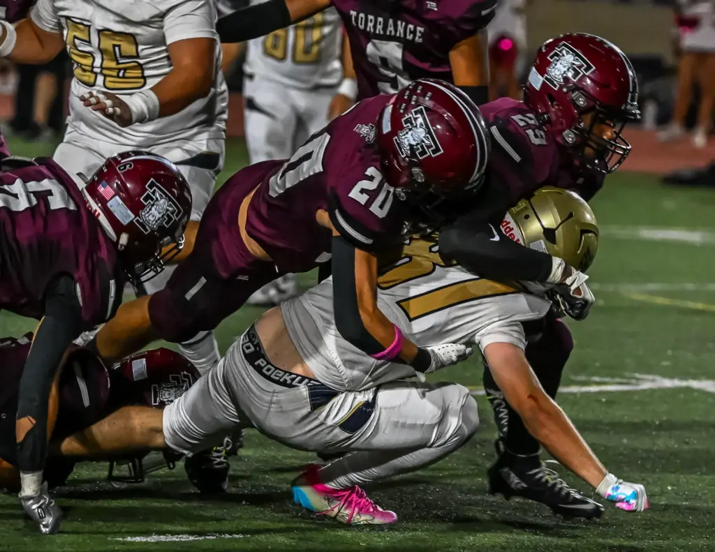 The Torrance High defense brings down the opposing runner during...
