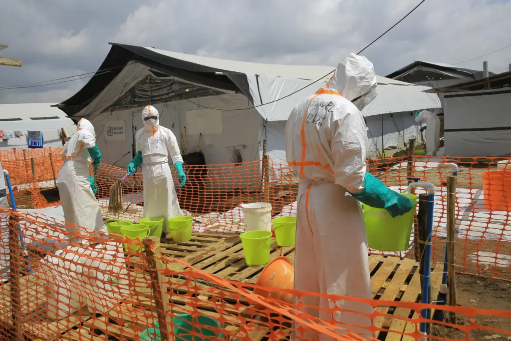 Health workers clean equipment inside a Ebola treatment camp in Butembo, Congo.